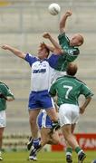 13 June 2004; John Quane, Limerick, in action against Michael Ahern, Waterford, as Limerick's Damien Reidy awaits the breaking ball. Bank of Ireland Munster Senior Football Championship Semi-Final, Limerick v Waterford, Gaelic Grounds, Limerick. Picture credit; Pat Murphy / SPORTSFILE
