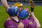 13 June 2004; Wexford players Eoin Quigley, yellow helmet, Rory Jacob, left, and Paul Carley celebrate victory. Guinness Leinster Senior Hurling Championship Semi-Final, Kilkenny v Wexford, Croke Park, Dublin. Picture credit; Ray McManus / SPORTSFILE