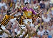 13 June 2004; Declan Ruth, Wexford, prepares to clear under pressure from Kilkenny players DJ Carey, left, and Henry Shefflin, right. Guinness Leinster Senior Hurling Championship Semi-Final, Kilkenny v Wexford, Croke Park, Dublin. Picture credit; Ray McManus / SPORTSFILE