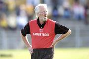 13 June 2004; John Croosy, Down manager, watches the game. Guinness Ulster Senior Hurling Championship Final Replay, Down v Antrim, Casement Park, Belfast. Picture credit; David Maher / SPORTSFILE