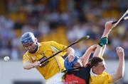 13 June 2004; Antrim's Michael Herron, left, and Jim Connolly in action against Gerard Adair, Down. Guinness Ulster Senior Hurling Championship Final Replay, Down v Antrim, Casement Park, Belfast. Picture credit; David Maher / SPORTSFILE