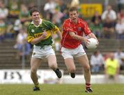 13 June 2004; Donncha Wiseman, Cork, in action against Mike Burke, Kerry. Munster Junior Football Championship Semi-Final, Kerry v Cork, Fitzgerald Stadium, Killarney, Co. Kerry. Picture credit; Brendan Moran / SPORTSFILE