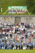 6 June 2004; St Michael's CBS Band march in front of the crowd during the pre match parade with a Sein Fein European election poster on the surrounding hillside. Bank of Ireland Ulster Senior Football Championship, Tyrone v Fermanagh, St. Tighernach's Park, Clones, Co. Monaghan. Picture credit; Damien Eagers / SPORTSFILE