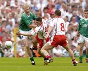 6 June 2004; Sean Cavangh, Tyrone, in action against Liam McBarron, Fermanagh, as Tyrone's Colin Holmes, 8, awaits the breaking ball. Bank of Ireland Ulster Senior Football Championship, Tyrone v Fermanagh, St. Tighernach's Park, Clones, Co. Monaghan. Picture credit; Damien Eagers / SPORTSFILE