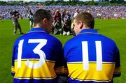 6 June 2004; Tipperary captain Tommy Dunne, left, in conversation with John Carroll while sitting on a bench before having their team photograph taken. Guinness Munster Senior Hurling Championship semi-final, Tipperary v Waterford, Pairc Ui Chaoimh, Cork. Picture credit; Brendan Moran / SPORTSFILE