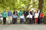 15 June 2004; At a photocall in St Stepehn's Green prior to the announcement of the Irish team for the 2004 Athens Paralympic Games at the Fitzwilliam Hotel, Dublin, were athletes, back, from left, Aidan Brennan, Football, Mark Kehoe, Cycling, David Malone, Swimming, Tony White, Judo, Derek Malone, Athletics, John O'Donoghue, TD, Minister for Sport, Tourism and the Arts, John Treacy, Chief Executive, Irish Sports Council, Breda Bernie, Equestrian, Jim McBride, Chef de Mission and Lisa Callaghan, Athletics. Front, from left, John Twomey, Sailing, John Fulham, Athletics, and Keith Hayes, Boccia. Picture credit; Brendan Moran / SPORTSFILE