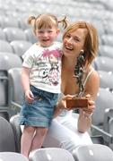 15 June 2004; Mary O'Donnell, Waterford, with her daughter Kailyn, aged 2, after winning the Irish Independent / Lucozade Sport Player of the Month for May. Croke Park, Dublin. Picture credit; David Maher / SPORTSFILE