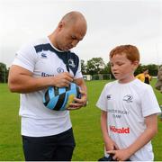 23 August 2013; Leinster's Richardt Strauss signs a ball  for Eric McCloskey, age 8, from Kilcock, Co. Kildare, during a Leinster Rugby Summer Camp at North Kildare  RFC, Kilcock, Co. Kildare. Picture credit: David Maher / SPORTSFILE