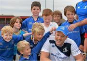 23 August 2013; Leinster's Jamie Heaslip poses for photographs with camp participants during a Leinster Rugby Summer Camp at Clontarf RFC, Clontarf, Co. Dublin. Picture credit: Brian Lawless / SPORTSFILE