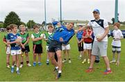23 August 2013; Leinster players Jamie Heaslip, right, and Ian Madigan, with camp participants during a Leinster Rugby Summer Camp at Clontarf RFC, Clontarf, Co. Dublin. Picture credit: Brian Lawless / SPORTSFILE