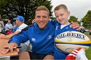 23 August 2013; Leinster's Ian Madigan, with Tadg Young, age 6, from Clongriffin, Dublin, during a Leinster Rugby Summer Camp at Clontarf RFC, Clontarf, Co. Dublin. Picture credit: Brian Lawless / SPORTSFILE