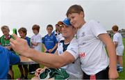 23 August 2013; Leinster's Jamie Heaslip takes a photo of himself and camp participant George Corr, age 10, from Artane, Dublin, during a Leinster Rugby Summer Camp at Clontarf RFC, Clontarf, Co. Dublin. Picture credit: Brian Lawless / SPORTSFILE
