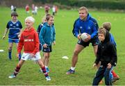 23 August 2013; Leinster's Ian Madigan with participants during a Leinster Rugby Summer Camp at Clontarf RFC, Clontarf, Co. Dublin. Picture credit: Brian Lawless / SPORTSFILE