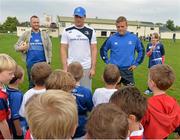 23 August 2013; Leinster players Ian Madigan and Jamie Heaslip, left, speaking with participants at a Leinster Rugby Summer Camp at Clontarf RFC, Clontarf, Co. Dublin. Picture credit: Brian Lawless / SPORTSFILE
