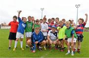 23 August 2013; Leinster players Ian Madigan and Jamie Heaslip with participants at a Leinster Rugby Summer Camp at Clontarf RFC, Clontarf, Co. Dublin. Picture credit: Brian Lawless / SPORTSFILE
