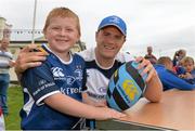 23 August 2013; Leinster's Jamie Heaslip with Cian Donnellan, age 7, from Baldoyle, Dublin, during a Leinster Rugby Summer Camp at Clontarf RFC, Clontarf, Co. Dublin. Picture credit: Brian Lawless / SPORTSFILE