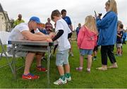 23 August 2013; Leinster's Jamie Heaslip signs autographs during a Leinster Rugby Summer Camp at Clontarf RFC, Clontarf, Co. Dublin. Picture credit: Brian Lawless / SPORTSFILE