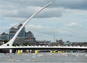 24 August 2013; A general view of swimmers as they pass the Samuel Beckett Bridge during the 94th Dublin City Liffey Swim. River Liffey, Dublin. Picture credit: Brian Lawless / SPORTSFILE