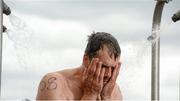 24 August 2013; Tim Gill, Dublin, showers after the 94th Dublin City Liffey Swim. River Liffey, Dublin. Picture credit: Brian Lawless / SPORTSFILE