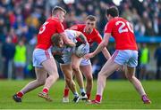 5 March 2023; Kevin O'Callaghan of Kildare in action against Louth players, from left, Peter Lynch, Ryan Byrnes and Tommy Durnin during the Allianz Football League Division 2 match between Louth and Kildare at Páirc Mhuire in Ardee, Louth. Photo by Ben McShane/Sportsfile