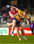 5 March 2023; Rory Maguire of Cork avoids the tackle of Dermot Coughlan of Clare during the Allianz Football League Division 2 match between Clare and Cork at Cusack Park in Ennis, Clare. Photo by Eóin Noonan/Sportsfile