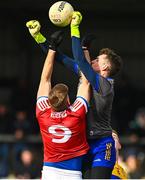 5 March 2023; Clare goalkeeper Stephen Ryan in action against Ian Maguire of Cork during the Allianz Football League Division 2 match between Clare and Cork at Cusack Park in Ennis, Clare. Photo by Eóin Noonan/Sportsfile