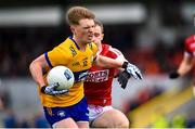 5 March 2023; Dermot Coughlan of Clare is tackled by Matty Taylor of Cork during the Allianz Football League Division 2 match between Clare and Cork at Cusack Park in Ennis, Clare. Photo by John Sheridan/Sportsfile