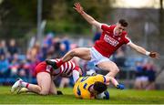 5 March 2023; Keelan Sexton of Clare is tackled by Daniel O’Mahony, left, and Cork goalkeeper Micheál Aodh Martin resulting in a penalty during the Allianz Football League Division 2 match between Clare and Cork at Cusack Park in Ennis, Clare. Photo by John Sheridan/Sportsfile