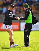 5 March 2023;  Mayo chartered physiotherapist Garrett Coughlan with Jordan Flynn before the Allianz Football League Division 1 match between Roscommon and Mayo at Dr Hyde Park in Roscommon. Photo by Piaras Ó Mídheach/Sportsfile