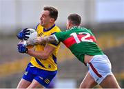 5 March 2023; Enda Smith of Roscommon in action against Jordan Flynn of Mayo during the Allianz Football League Division 1 match between Roscommon and Mayo at Dr Hyde Park in Roscommon. Photo by Piaras Ó Mídheach/Sportsfile