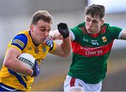 5 March 2023; Enda Smith of Roscommon in action against Paddy Durcan of Mayo during the Allianz Football League Division 1 match between Roscommon and Mayo at Dr Hyde Park in Roscommon. Photo by Piaras Ó Mídheach/Sportsfile
