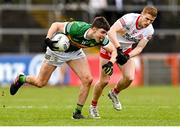 5 March 2023; Seán O'Shea of Kerry is tackled by Peter Harte of Tyrone during the Allianz Football League Division 1 match between Tyrone and Kerry at O'Neill's Healy Park in Omagh, Tyrone. Photo by Ramsey Cardy/Sportsfile