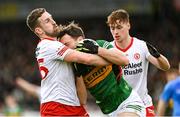 5 March 2023; David Clifford of Kerry is tackled by Niall Sludden, left, and Conor Meyler of Tyrone during the Allianz Football League Division 1 match between Tyrone and Kerry at O'Neill's Healy Park in Omagh, Tyrone. Photo by Ramsey Cardy/Sportsfile