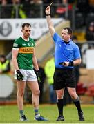 5 March 2023; Referee Martin McNally shows a yellow card to Jack Barry of Kerry during the Allianz Football League Division 1 match between Tyrone and Kerry at O'Neill's Healy Park in Omagh, Tyrone. Photo by Ramsey Cardy/Sportsfile