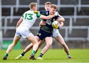 5 March 2023; Brían Conlon of Meath is tackled by Killian Ryan, left, and Barry Coleman of Limerick during the Allianz Football League Division 2 match between Limerick and Meath at TUS Gaelic Grounds in Limerick. Photo by Tyler Miller/Sportsfile