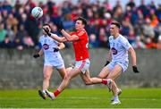 5 March 2023; Craig Lennon of Louth scores a point despite the attention of Mick O'Grady of Kildare during the Allianz Football League Division 2 match between Louth and Kildare at Páirc Mhuire in Ardee, Louth. Photo by Ben McShane/Sportsfile