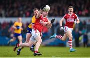 5 March 2023; Ruairí Deane of Cork is tackled by Darragh Bohannon of Clare during the Allianz Football League Division 2 match between Clare and Cork at Cusack Park in Ennis, Clare. Photo by John Sheridan/Sportsfile