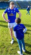 5 March 2023; Padraig Faulkner of Cavan chats to a young fan after the Allianz Football League Division 3 match between Cavan and Down at Kingspan Breffni in Cavan. Photo by Stephen Marken/Sportsfile
