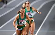 5 March 2023; Sharlene Mawdsley of Ireland, left, takes the baton from Sophie Becker in the women's 4x400m relay final during Day 3 of the European Indoor Athletics Championships at Ataköy Athletics Arena in Istanbul, Türkiye. Photo by Sam Barnes/Sportsfile