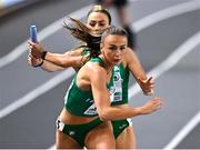 5 March 2023; Sharlene Mawdsley of Ireland receives the baton from Sophie Becker competes in the women's 4x400m relay final during Day 3 of the European Indoor Athletics Championships at Ataköy Athletics Arena in Istanbul, Türkiye. Photo by Sam Barnes/Sportsfile