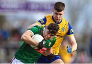 5 March 2023; Tommy Conroy of Mayo in action against Conor Daly of Roscommon during the Allianz Football League Division 1 match between Roscommon and Mayo at Dr Hyde Park in Roscommon. Photo by Piaras Ó Mídheach/Sportsfile