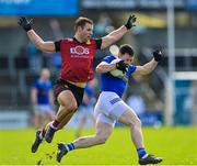 5 March 2023; Ryan O'Neill of Cavan in action against Gerard Collins of Down during the Allianz Football League Division 3 match between Cavan and Down at Kingspan Breffni in Cavan. Photo by Stephen Marken/Sportsfile
