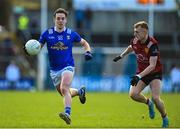 5 March 2023; Gerard Smith of Cavan in action against Liam Kerr of Down during the Allianz Football League Division 3 match between Cavan and Down at Kingspan Breffni in Cavan. Photo by Stephen Marken/Sportsfile