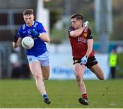 5 March 2023; Paddy Lynch of Cavan in action against Patrick Branagan of Down during the Allianz Football League Division 3 match between Cavan and Down at Kingspan Breffni in Cavan. Photo by Stephen Marken/Sportsfile