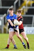 5 March 2023; James Smith of Cavan in action against Odhran Murdock of Down during the Allianz Football League Division 3 match between Cavan and Down at Kingspan Breffni in Cavan. Photo by Stephen Marken/Sportsfile
