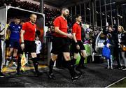 3 March 2023; Officials, from left, assistant referee Robert Clarke, referee Paul McLaughlin and assistant referee Shane O'Brien leads the players on to the pitch before the SSE Airtricity Men's Premier Division match between Dundalk and St Patrick's Athletic at Oriel Park in Dundalk, Louth. Photo by Ben McShane/Sportsfile