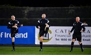 3 March 2023; Officials, from left, assistant referee Robert Clarke, referee Paul McLaughlin, and assistant referee Shane O'Brien warm-up before the SSE Airtricity Men's Premier Division match between Dundalk and St Patrick's Athletic at Oriel Park in Dundalk, Louth. Photo by Ben McShane/Sportsfile