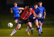 6 March 2023; Cian Kavanagh of Derry City is tackled by Harvey O'Brien of UCD during the SSE Airtricity Men's Premier Division match between UCD and Derry City at the UCD Bowl in Dublin. Photo by Stephen McCarthy/Sportsfile