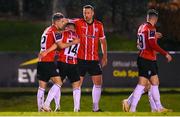 6 March 2023; Jordan McEneff of Derry City, left, celebrates with teammates, Ben Doherty, centre, and Shane McEleney after scoring his side's first goal  during the SSE Airtricity Men's Premier Division match between UCD and Derry City at the UCD Bowl in Dublin. Photo by Stephen McCarthy/Sportsfile