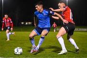 6 March 2023; Brendan Barr of UCD in action against Ben Doherty of Derry City during the SSE Airtricity Men's Premier Division match between UCD and Derry City at the UCD Bowl in Dublin. Photo by Stephen McCarthy/Sportsfile